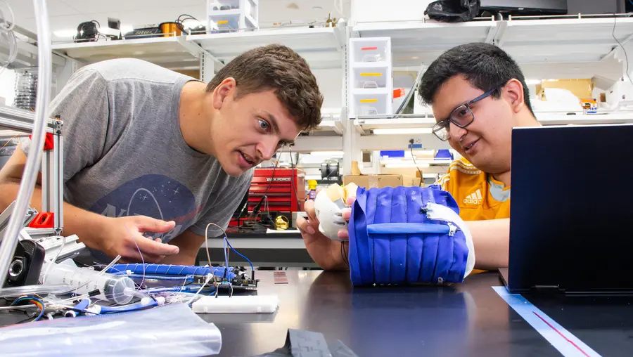 Researchers working in Vickie Webster-Wood's Lab.